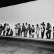 Police evacuate apartment building in search of sniper suspects during Detroit’s 1967 riots. (Lee Balterman/The Life Pictures)